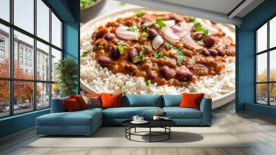 A traditional North Indian meal of Rajma Chawal, served on a white plate with kidney bean curry and steaming hot rice. Garnished with coriander and onions. Wall mural