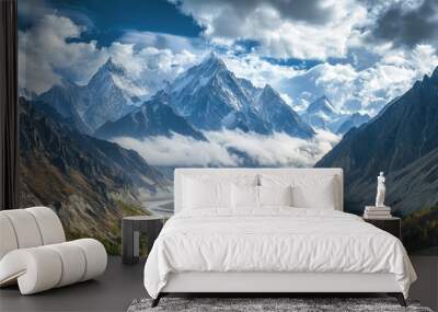 Cloud-shrouded peaks of Passu Cones stand tall, with the Karakoram Highway winding through the serene landscape of Hunza Valley, Gilgit Baltistan. Wall mural