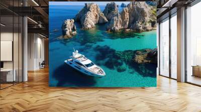 Elegant white yacht anchored near Sardiniaaes famous Cala Luna beach, with pristine waters and dramatic rock formations surrounding it Wall mural