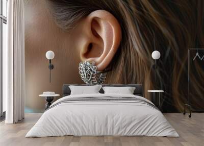 Trendy ear featuring stylish ear cuffs with a unique pattern, highlighting their contemporary design and chic look Wall mural