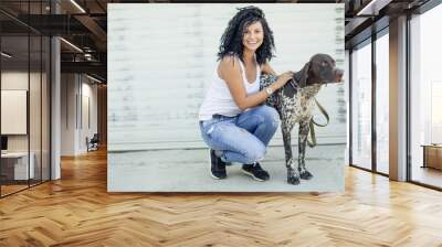 Beautiful woman with a dog  Wall mural