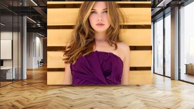 portrait of a beautiful woman wooden background  Wall mural