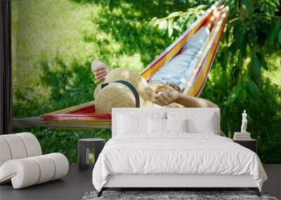 Summer vacation - lovely girl in a colorful hammock. High quality photo Wall mural