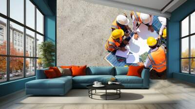 Ethnic diversity worker people, Success teamwork. Group of professional engineering people wearing hardhat safety helmet meeting with solar photovoltaic panels discussion in new project Wall mural