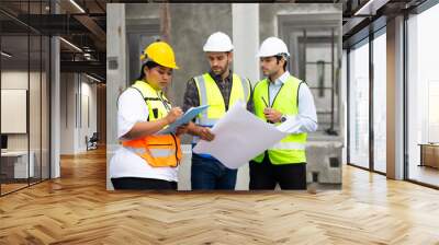 hispanic engineering man and fat female. Ethnic diversity worker people, Success teamwork. Group of professional engineering people wearing hardhat safety helmet meeting discussion in new project Wall mural