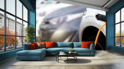 Loading energy of an electric car in Prague Czech republic Wall mural