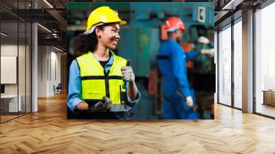 Thumps up black woman. Portrait african american female engineer worker wearing safety hard hat helmet. Metal lathe industrial manufacturing factory Wall mural