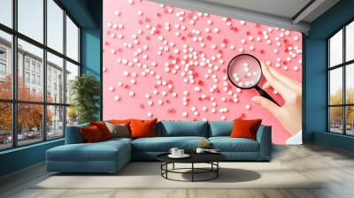 Scientist Examining Particles with a Magnifying Glass Wall mural