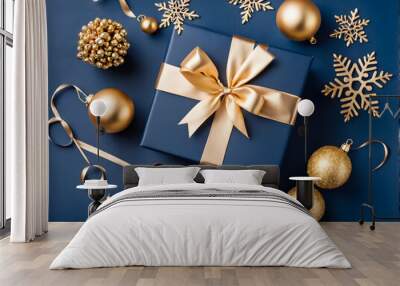 Chic navy Christmas gift box on a classic blue background with gold baubles. Elegant holiday card concept. Festive and stylish Wall mural