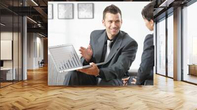 Businessman showing grapth on computer Wall mural