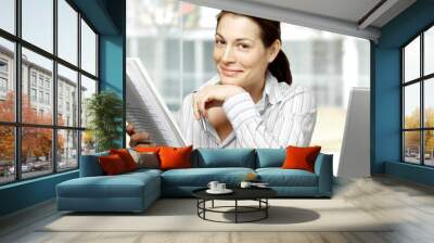 businesswoman reads document Wall mural