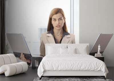 desperate businesswoman with two laptops Wall mural