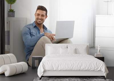 happy man with laptop Wall mural