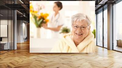 Portrait of happy elderly woman Wall mural