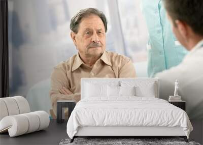 Senior patient listening to doctor Wall mural