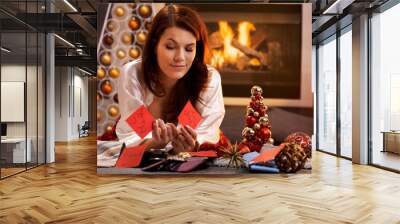 Smiling girl decide on christmas presents Wall mural