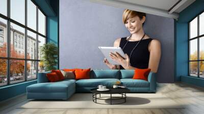 young businesswoman using tablet Wall mural