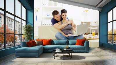 young couple with computer Wall mural