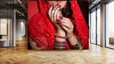 beautiful girl in the image of indian woman in a red sari with beautiful patch acrylic nails in orie Wall mural