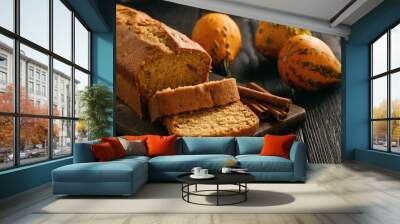 Homemade pumpkin cake on black wooden background. Wall mural