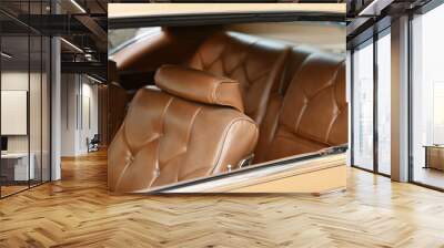 A brown vintage armchair in a car interior Wall mural