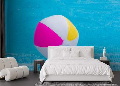 Colorful ball on water close up Wall mural