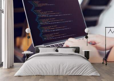 Closeup coding on screen, Woman hands coding html and programming on screen laptop. Wall mural