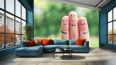 Happy finger art family group of loving mother and father with son while smiley face at blurred outdoor park background. Retro filter effect. copy space. Wall mural