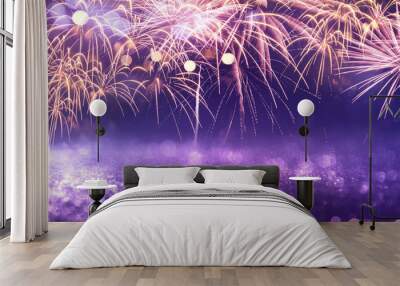 Purple fireworks and bokeh in New Year eve and copy space. Abstract background holiday. Wall mural