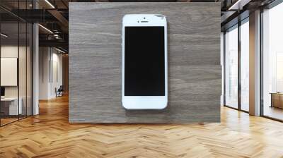 Mobile phone Bokeh screen on wood floor dark tone Wall mural