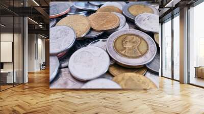 Close-up of a pile of Thai 1 baht silver coins, 2 baht silver coins, 5 baht silver coins, 10 baht silver coins, high resolution background image. Wall mural