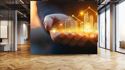 Hands holding glowing buildings and houses. Wall mural