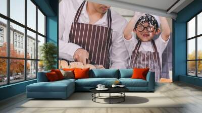 father and the son cooking white flour Kneading bread dough Father teaches children practice baking ingredients bread, egg on tableware in kitchen lifestyle happy Learning life family Fun to learn Wall mural