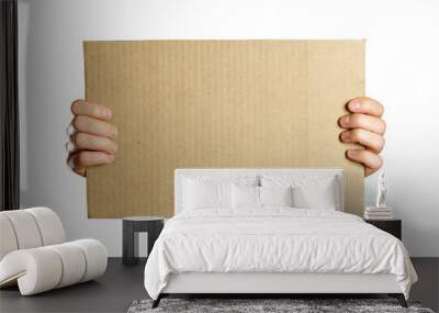 Hands holding a piece of cardboard. Isolated on a white background. Prepared for your text Wall mural