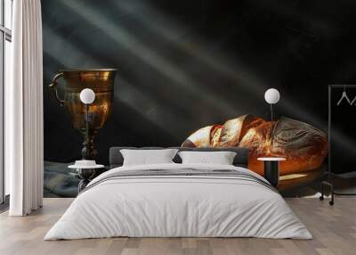 Chalice with wine and bread on a wooden tray on a dark background Wall mural