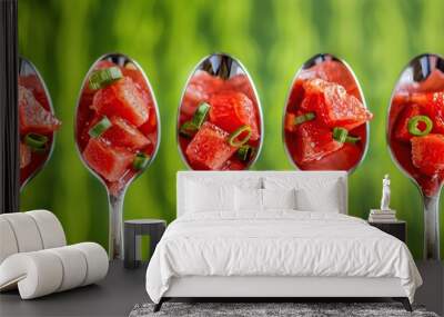 Spoons with delicious watermelon on green background, closeup Wall mural