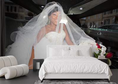 beautiful young black american bride with white veil in luxury limousine car Wall mural