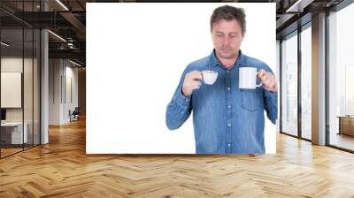 portrait of a man choosing cup of tea or coffee Wall mural