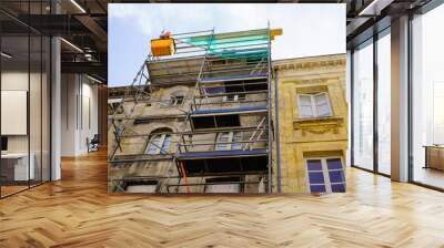 Reconstruction with scaffolding old building in Bordeaux France Wall mural