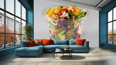 Salad in takeaway container on white background Wall mural