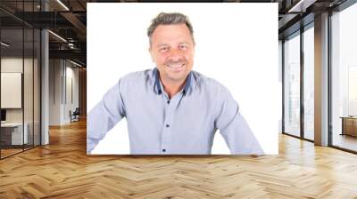 Smiling young bearded man in blue shirt posing isolated on white wall background studio portrait Wall mural