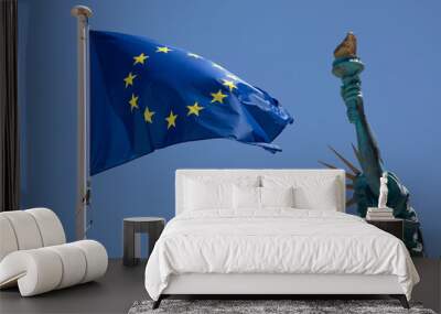 Statue of Liberty with flag of European Union EU in blue sky in mast with blue background and yellows stars Wall mural