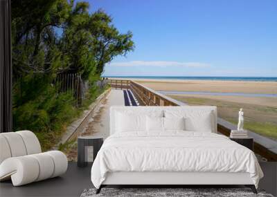 wooden pontoon walkway on sandy beach side in atlantic ocean coast horizon in Jard sur Mer in france Wall mural