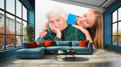 Elderly woman and young doctor Wall mural