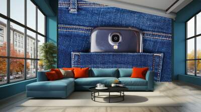 mobile phone and blue jeans Wall mural