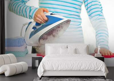 young lady ironing her clothes Wall mural