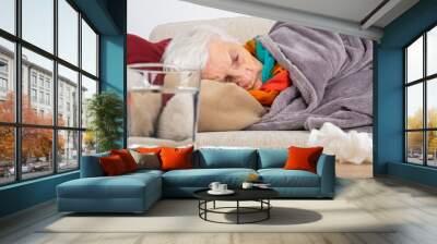 Senior woman having influenza Wall mural