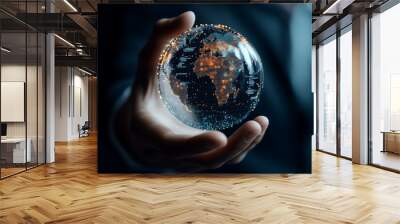 A hand holding a glowing digital representation of Earth with illuminated networks, illustrating globalization, technology, and innovation in a futuristic style. Wall mural