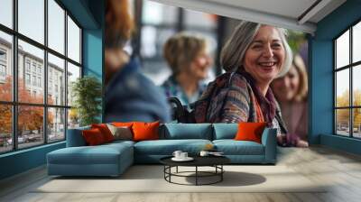 An elderly woman with silver hair smiles warmly at a social event, displaying a sense of joy and community Wall mural