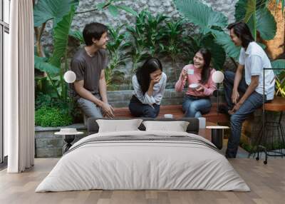 asian boys and girls laughing while having fun together at home garden Wall mural